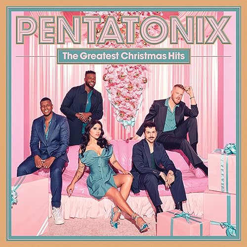 The five members of Pentatonix pose on a pink couch surrounded by gift boxes.