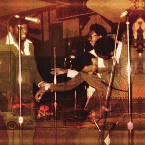 Vinyl record cover featuring two men in a warmly-toned, vintage interior.