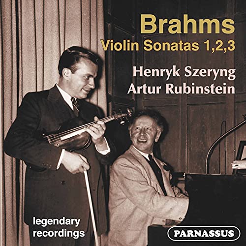 Black and white photo of two musicians, Szeryng playing violin, Rubinstein at piano.
