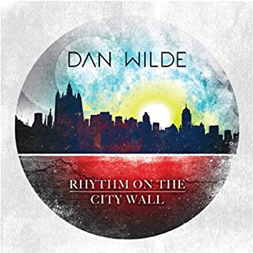CD cover for Dan Wilde’s “Rhythm On The City Wall” with a skyline.