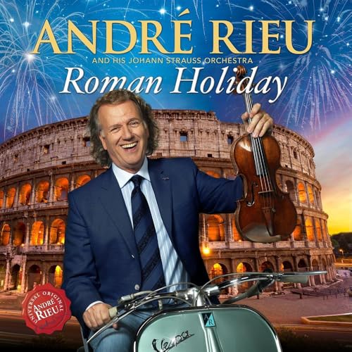 André Rieu holds a violin in front of the Colosseum and a Vespa.