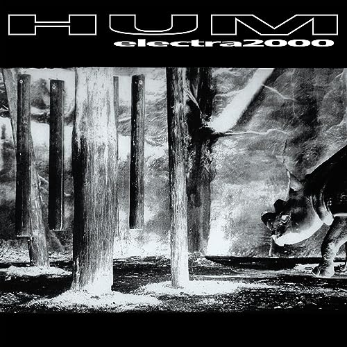 Album cover for Hum’s “Electra 2000” featuring a rhino in a forest.