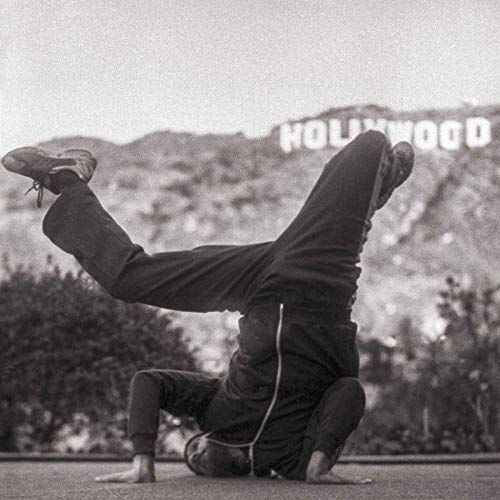 Black and white vinyl record cover featuring a dancer with the Hollywood sign.