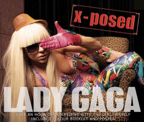 Lady Gaga in colorful outfit and sunglasses poses on a leopard print chair.