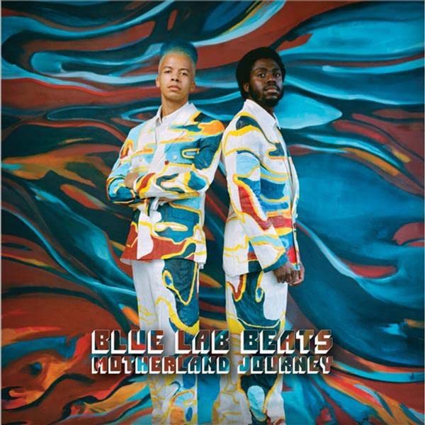 Album cover featuring two men in patterned jackets against a swirling, colorful background.