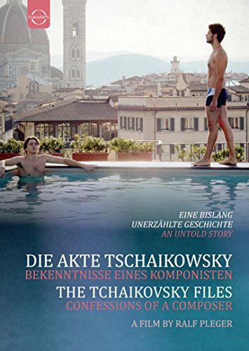 Two men by a pool with a city skyline in the background.
