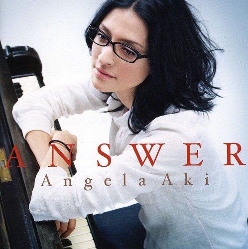CD cover featuring Angela Aki with piano, text “ANSWER” and her name.