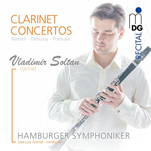 Clarinetist Vladimir Soltan holds a clarinet, CD cover for classical concertos.