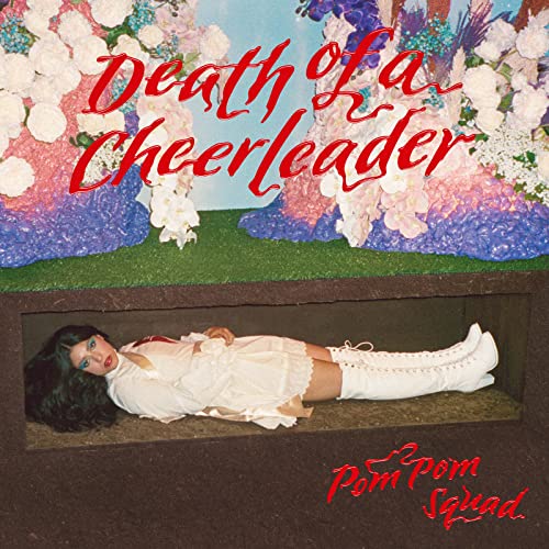 CD cover: woman in a coffin surrounded by flowers.