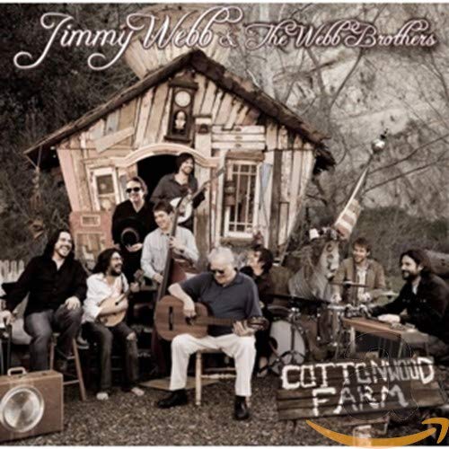 CD cover: musicians gathered in front of a rustic wooden shack.