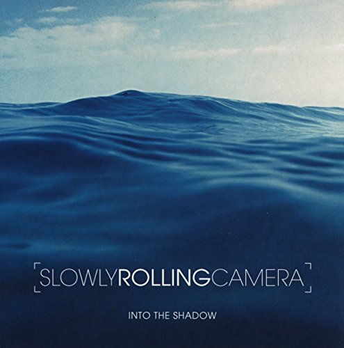 CD cover: blue ocean waves with band name "Slowly Rolling Camera".