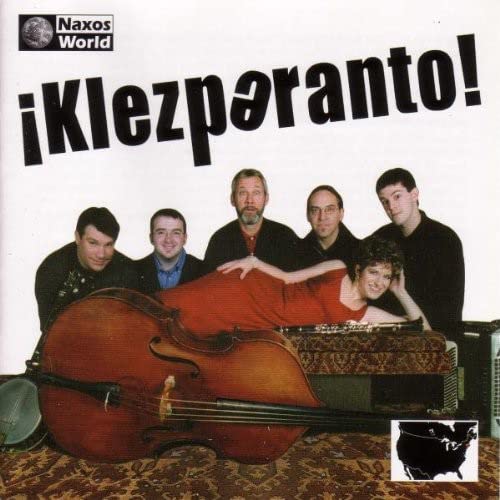 CD cover featuring a band with instruments, including a large cello.