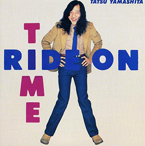 Tatsuro Yamashita album cover: man in brown jacket, bold text.