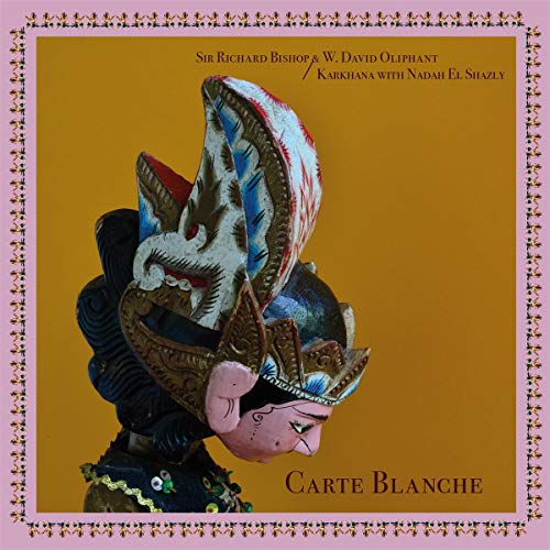 Vinyl album cover: ornate, colorful Javanese shadow puppet against gold background.