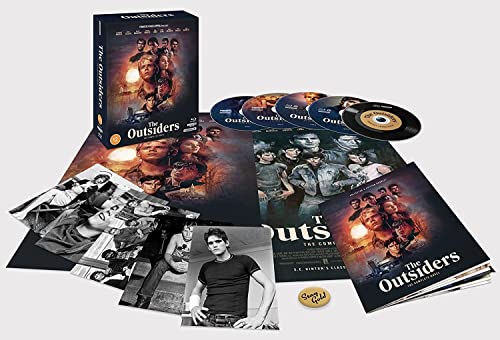 The Outsiders" Blu-ray box set with discs, book, and character photos.