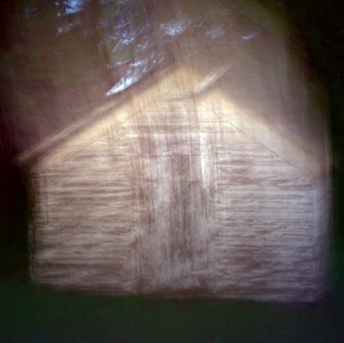 Vinyl record cover with abstract, blurred image of a building.