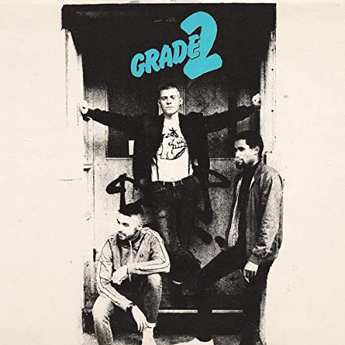 Album cover for Grade 2 featuring three men in front of a doorway.