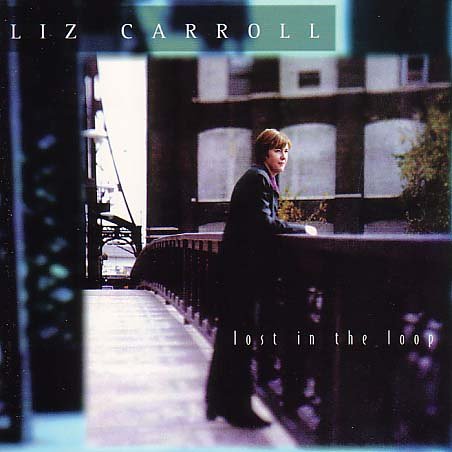 Liz Carroll standing on a bridge in front of a dark building, album cover art.