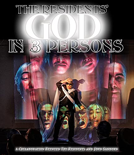 Blu-ray cover for "God In 3 Persons" featuring a performer and projected faces.