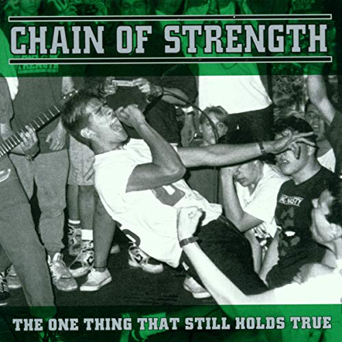 Black and white CD cover with a crowd scene and band member singing.