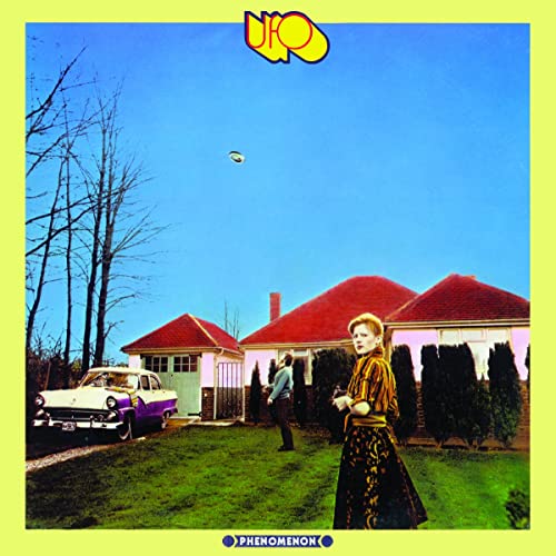 Album cover: woman, house, car, and a flying saucer in a blue sky.