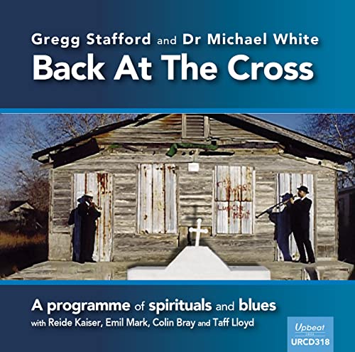 CD cover: weathered church with two figures, text “Back At The Cross”.