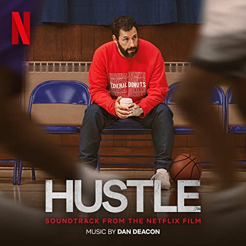 Album cover for "Hustle" soundtrack featuring Adam Sandler in a basketball gym.