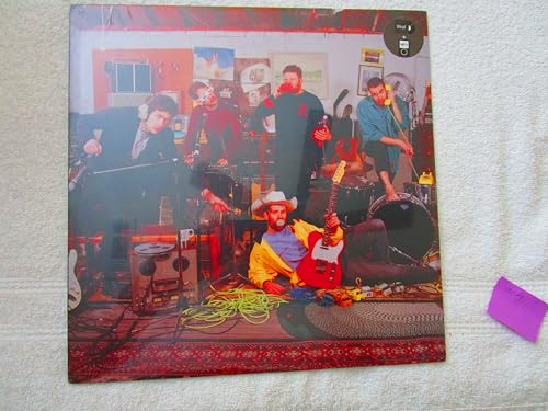 Vinyl record album cover featuring a band in a brightly lit room.