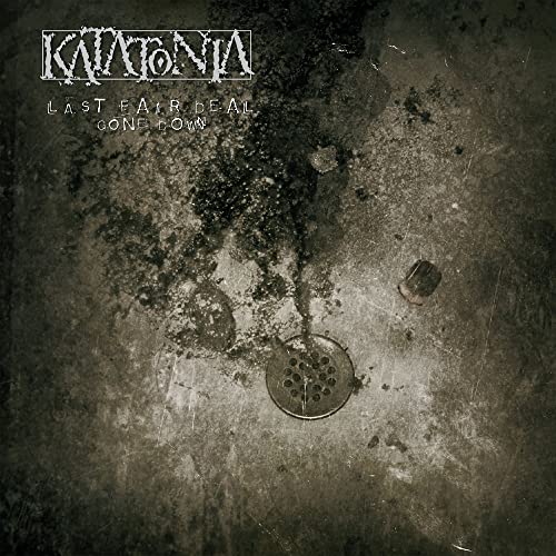 Katatonia album cover: dark, textured background with a drain and band logo.