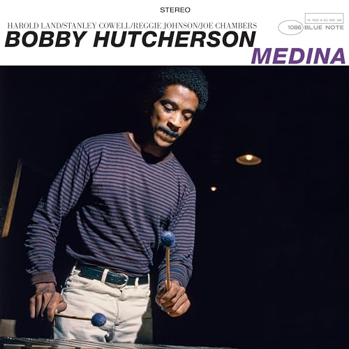 Bobby Hutcherson album cover, portrait of musician with vibraphone.