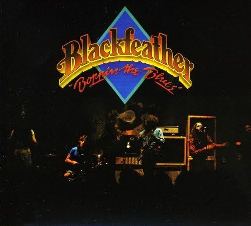 Blackfeather album cover: band playing instruments in a dimly lit room.