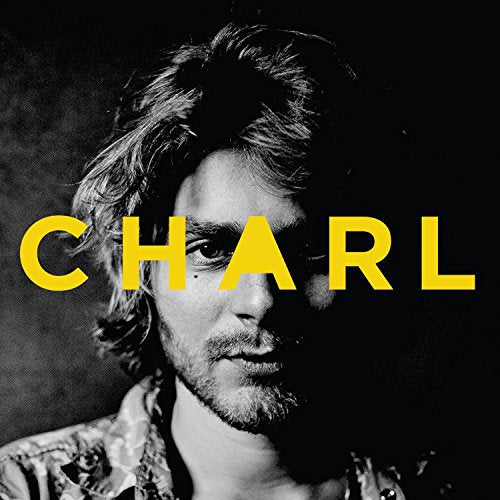 Black and white portrait of a man with yellow text reading "CHARL".
