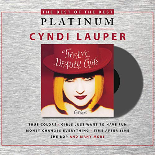 Cyndi Lauper album cover: red background, artist in a hat, song titles below.