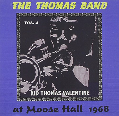 CD cover: black and white photo of musicians, yellow and purple text.