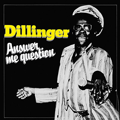 Black and white portrait of Dillinger holding a microphone, album cover.