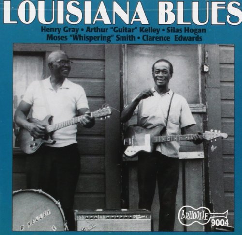 Two Black musicians playing guitars in front of a wooden building.