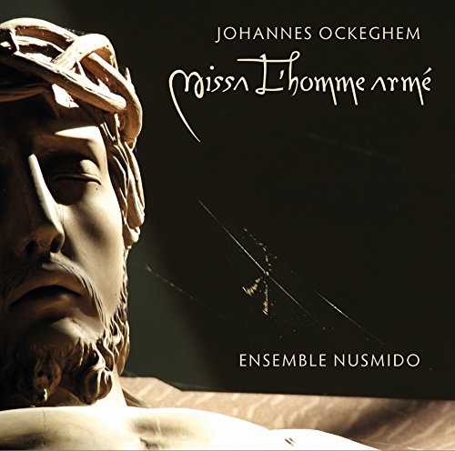 CD cover featuring a close-up of a sculpted head with dark background.