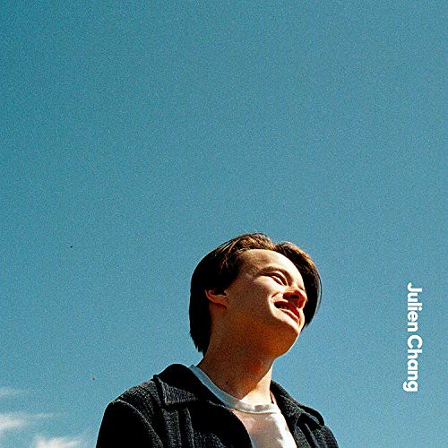 CD cover: Man looking up at a bright blue sky.