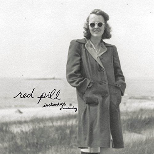 Black and white CD cover featuring a woman in a coat and sunglasses.