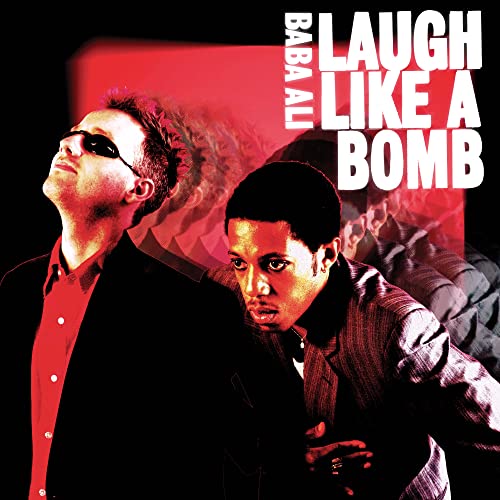 Album cover featuring two men in suits with red and black text.