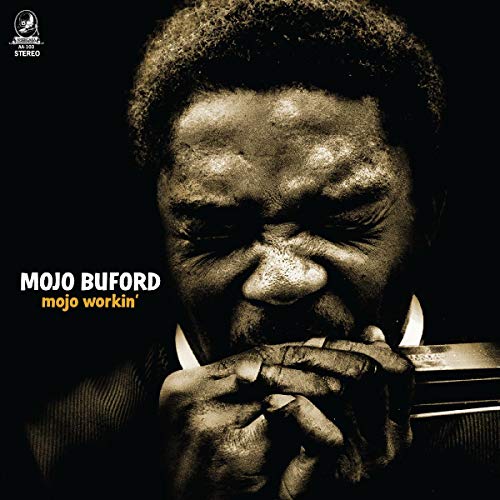 Close-up portrait of Mojo Buford playing a harmonica, album cover.