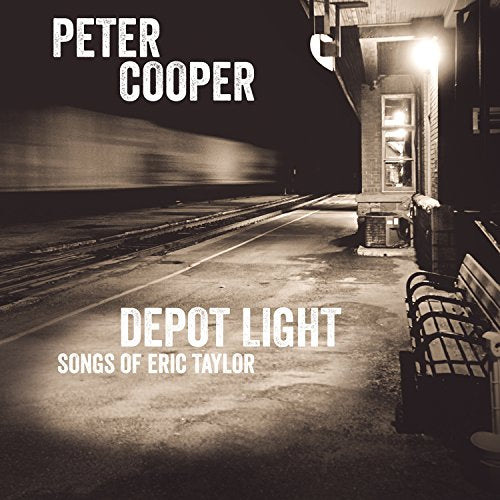 CD cover: Night scene of a train depot with a bright light.