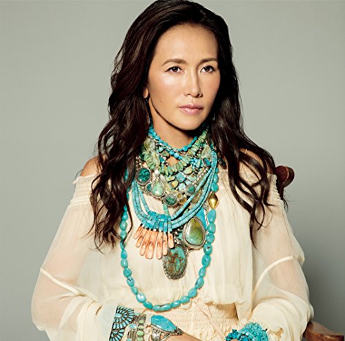 Shizuka Kudo album cover featuring the singer with turquoise jewelry.