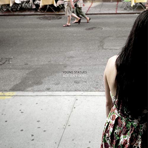 Album cover with a woman’s back and blurred figures walking away.