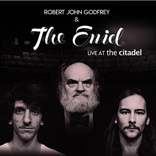 CD cover featuring three musicians and a theatre backdrop.