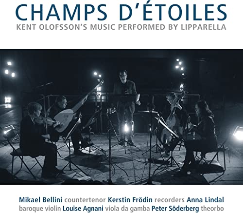 CD cover featuring a live musical ensemble performing on stage.