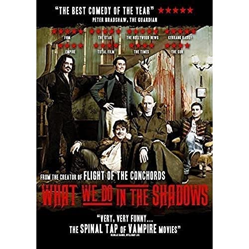 What We Do In The Shadows" DVD cover featuring four vampires and a human.
