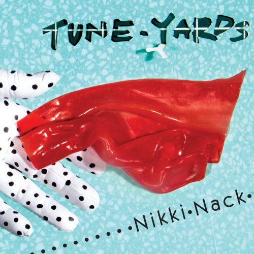 Album cover for Tune-yards’ Nikki Nack, featuring a hand and red object.