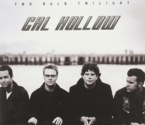 Black and white CD cover featuring four men and a pier backdrop.