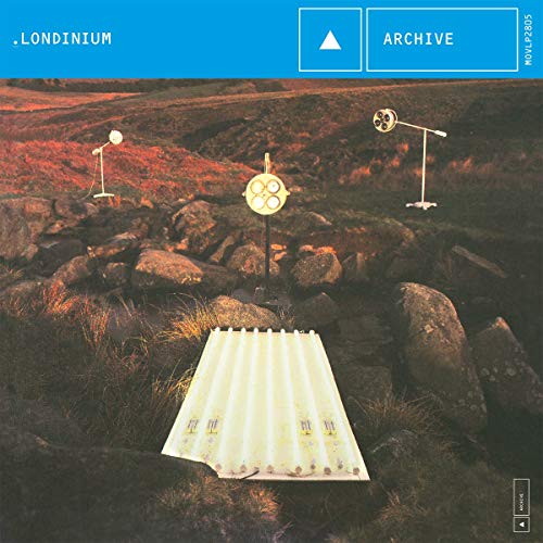 Vinyl album cover showing medical lamps in a rocky, grassy landscape at dusk.